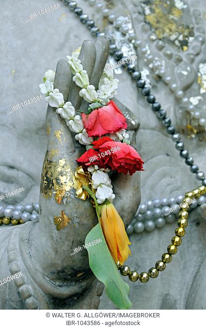 Gesture of discussion, Mudra, hand of a Buddha statue decorated with a floral garland, Wat Chana Songkhram, Bangkok, Thailand, Asia