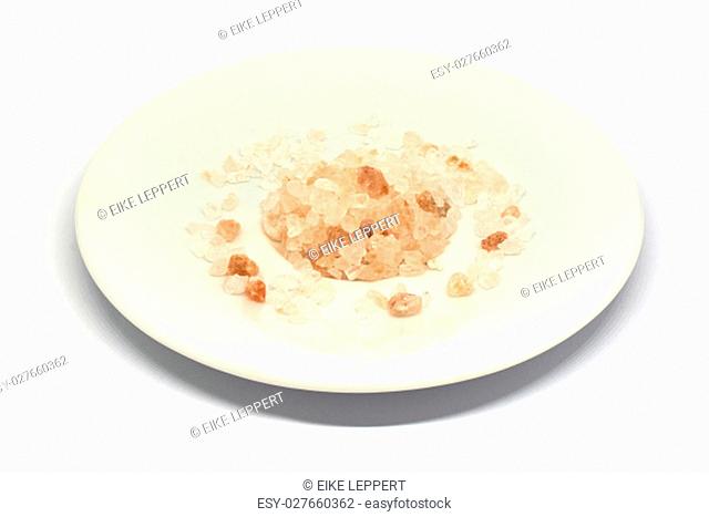 Himalayan salt pile on white background isolated