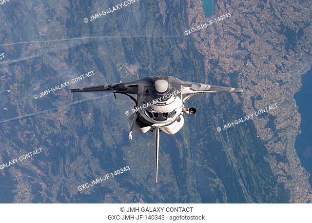 Space Shuttle Discovery was about 600 feet from the International Space Station when cosmonaut Sergei K. Krikalev, Expedition 11 commander, and astronaut John L