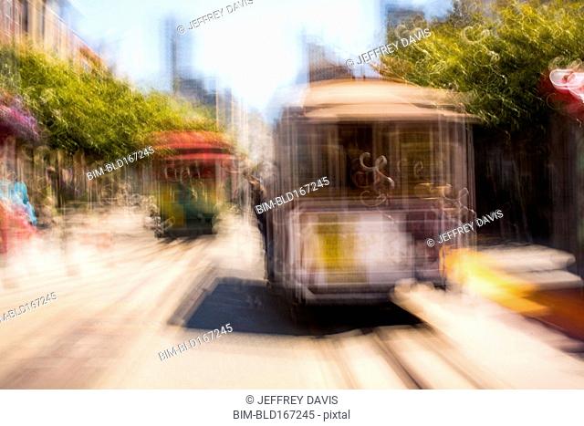 Blurred view of cable cars on tracks, San Francisco, California, United States