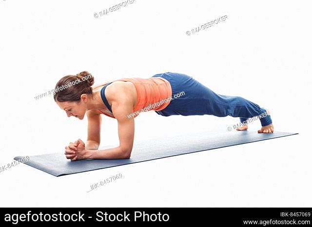 Woman doing Yoga asana Chaturanga dandasana variation, four-limbed staff pose or plank pose variation isolated on white background