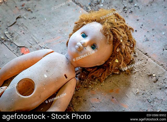 Abandoned child doll in a abandoned house in Belarus Chernobyl exclusion zone