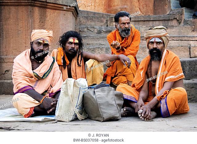 Sadhu, holy men, on a stair, India, Varanasi