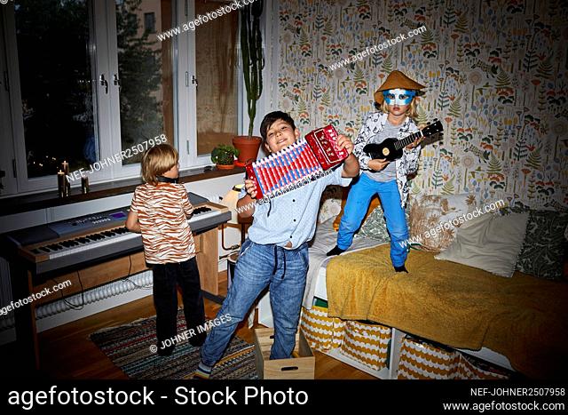 Boys playing in bedroom