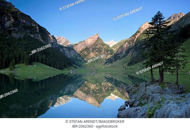 Early morning at Seealpsee Lake with view of Mt Saentis and the Alpstein range, Switzerland, Europe