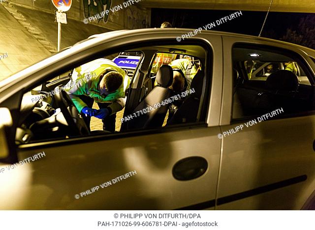 Police officers carry out roadside inspections of vehicles passing through Lehrte, Germany, 26 October 2017. The police controlled cars in the city as part of...