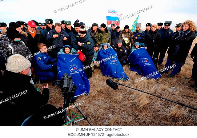 Soyuz TMA-19 crewmembers -- NASA astronaut Doug Wheelock, (second left in blue), Expedition 25 commander, along with Russian cosmonaut Fyodor Yurchikhin