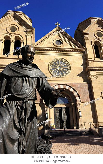 The statue of St. Francis of Assisi the patron saint of Santa Fe in front of the Cathedral Basilica of St. Francis of Assisi. Santa Fe. New Mexico