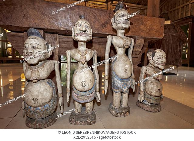 Wooden figures displayed in the Setia Darma House of Masks and Puppets. Mas, Ubud, Bali, Indonesia
