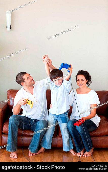 Loving family playing video games in the living-room
