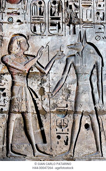 Medinet Habu, Luxor, Egypt, Djamet, mortuary temple of King Ramses III, XX dyn. 1185 -1078 B.C: the king offers incense to god Anubis