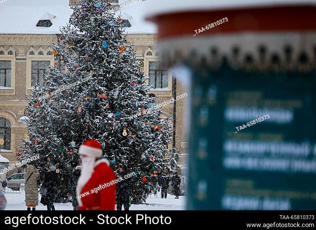 RUSSIA, RYBINSK - DECEMBER 16, 2023: A performer dressed in a Father Frost (Russian Santa Claus) costume is seen in Red Square before the start of a parade of...