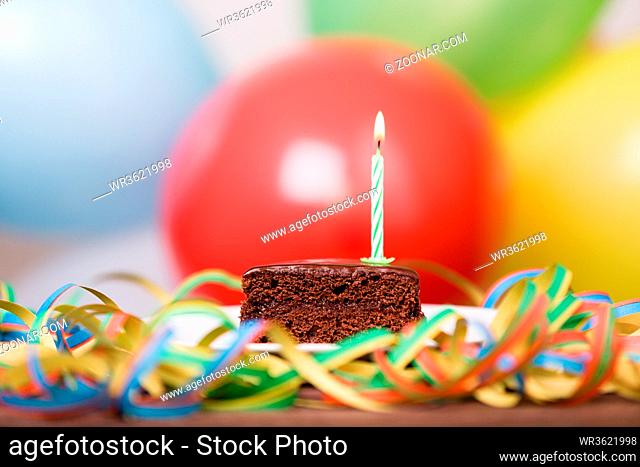 Colorful birthday party cake with candles. Birthday, party and family concept