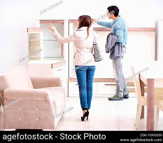 The married couple in the shop choosing furniture