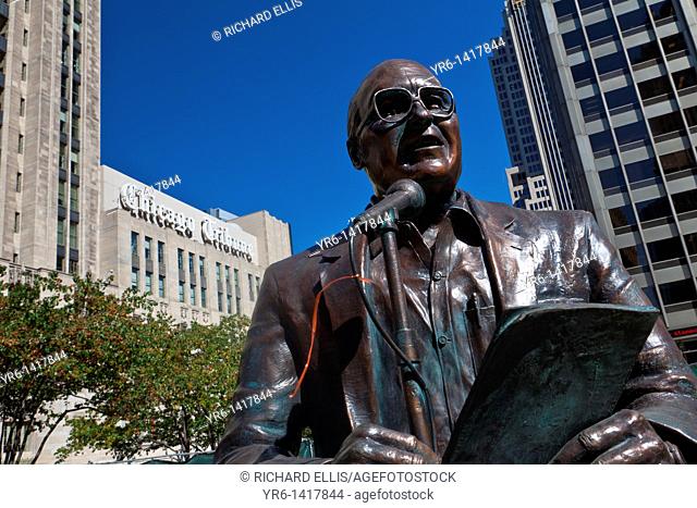 Statue of legendary Chicago broadcaster Jack Brickhouse in Pioneer Court along Michigan Ave Bridge in Chicago, IL, USA