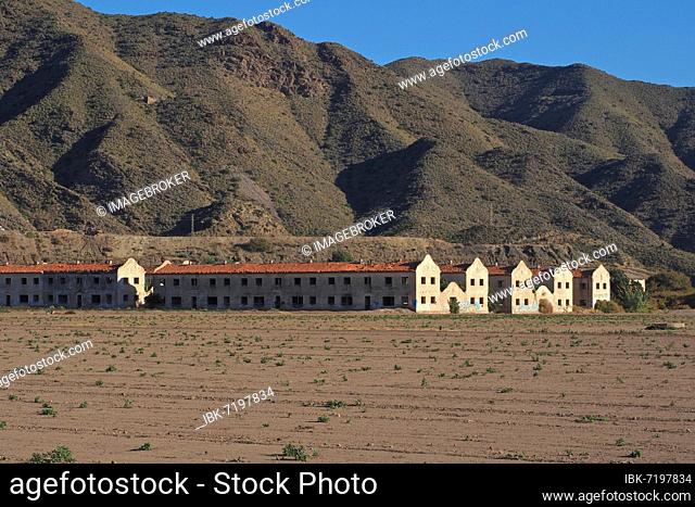 Settlement for workers of a mine in front of bare mountains, housing estate of mine workers, Villaricos, Andalusia, Spain, Europe