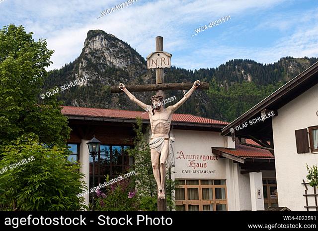 Oberammergau, Bavaria, Germany, Europe - A woodcraft depicts Jesus Christ on the cross in the small Bavarian town located in the administrative district of...