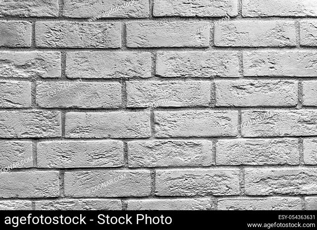 Abstract weathered texture stained old stucco light gray and aged paint white brick wall background in rural room, grungy rusty blocks of stonework technology...