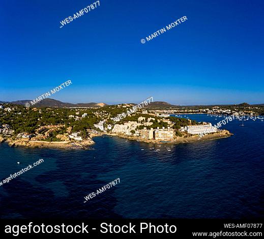 Spain, Balearic Islands, Costa de la Calma, Aerial view of clear blue sky over coastal town in summer