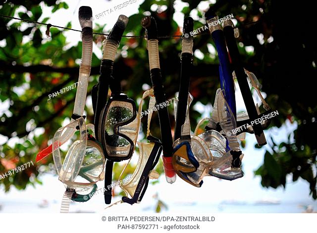 Snorkles and diving goggles hang to dry in Stone Town, Tanzania, 6 March 2016. Photo: Britta Pedersen/dpa-Zentralbild/ZB | usage worldwide