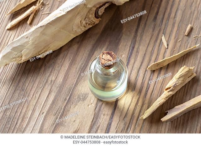 A bottle of essential oil with white sandalwood