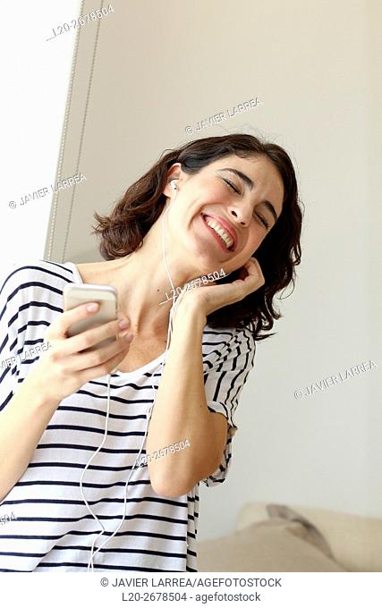 Woman listening music with Smartphone