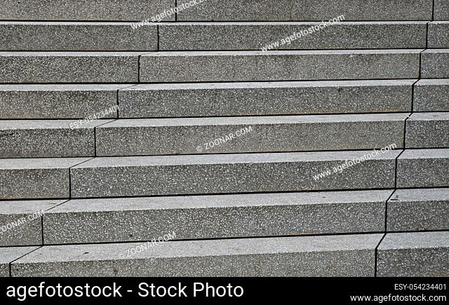 Close up grey concrete stairs perspective ascending, low angle view