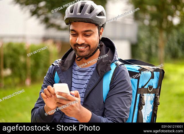 food delivery man with thermal bag and smartphone