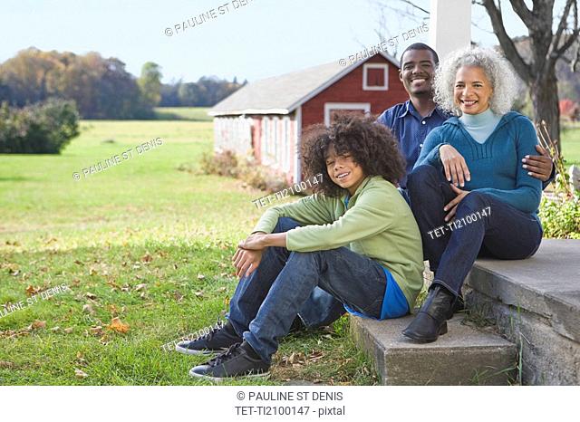 Family sitting on porch