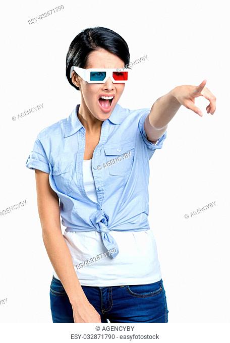 Pointing with hand pretty girl in 3D glasses, isolated on white. Expression of disgust