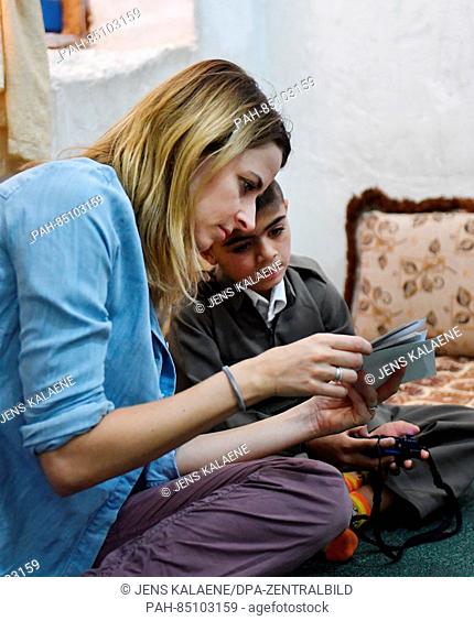 EXCLUSIVE - UNICEF ambassador Eva Padberg visits the family of nine-year-old Murat in a refugee camp for Syrian refugees in the Dohuk region, Iraq