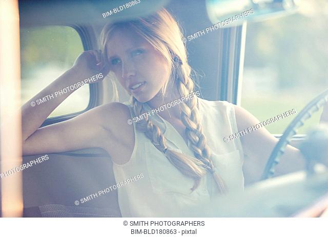 Caucasian woman driving car