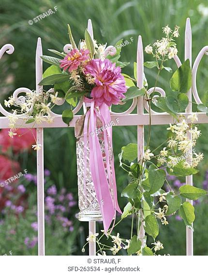 Floral decoration with dahlias on garden fence