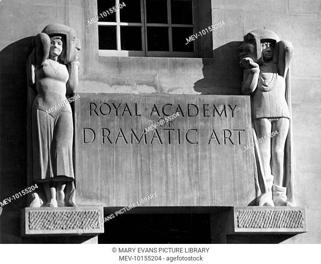 'Comedy' and 'Tragedy' figures with Ancient Greek masks, by sculptor Alan Durst, carved in Portland stone, over the doorway of the Royal Academy of Dramatic...
