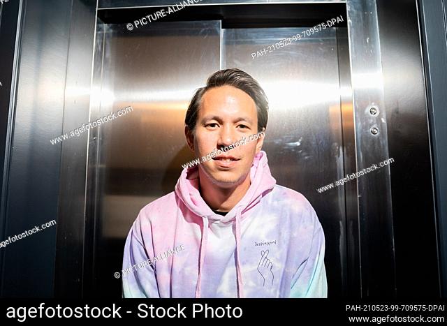 PRODUCTION - 07 May 2021, Berlin: Chino con Estilo from the band Culcha Candela stands in a building entrance before an interview with the German Press Agency