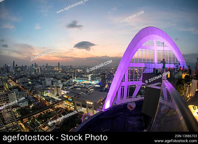 the Skyline of Bangkok by night and view from the Cru Bar of the Centara Grand Hotel in the city of Bangkok in Thailand in Southeastasia