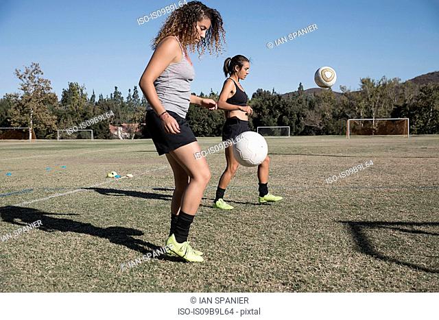 Women of football pitch playing football