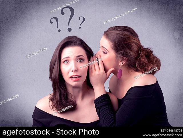 A teenager girl looking confused with drawn question marks above the head, while a girlfriend whispers something in her ear concept
