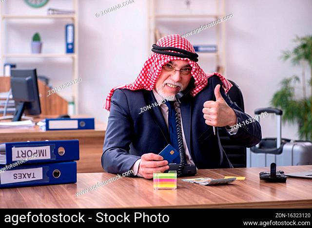 Old arab businessman working in the office