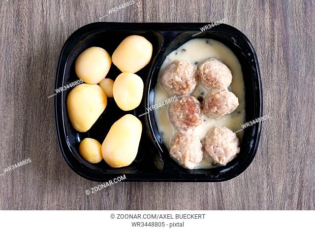 meatballs and potatoes microwavable instant ready meal or tv dinner, german dish known as Konigsberger Klopse