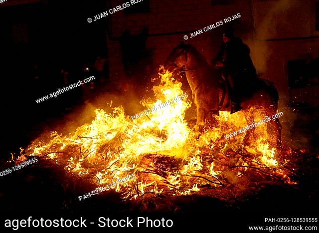 San Bartolomé de Pinares. Avila, Spain; 16/07/2020.- Horses and riders jump into the fire at Las Luminarias festival held in San Bartolomé de Pinares, Spain