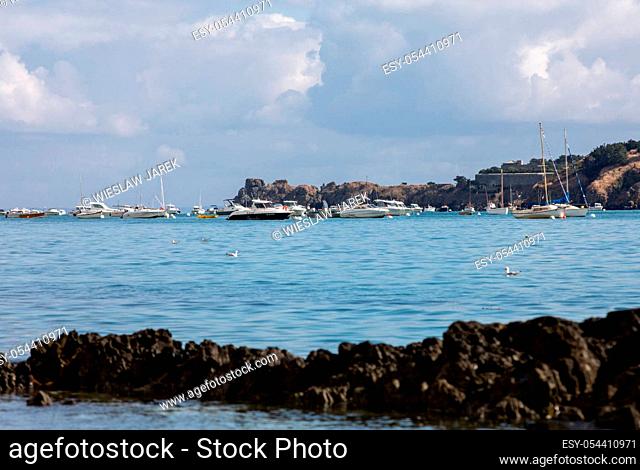 Cancale, France - September 15, 2018: Fishing boats and yachts moored in the bay at high tide in Cancale, famous oysters production town
