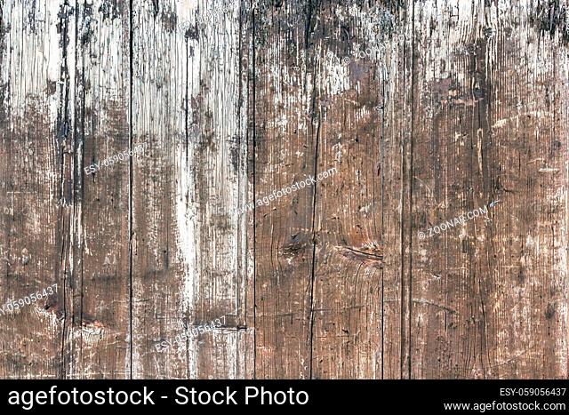 Weathered wooden background. Old wooden plankswith peeling paint. Background of old painted wood fragment