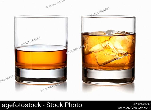 Glass of whisky and ice isolated white background