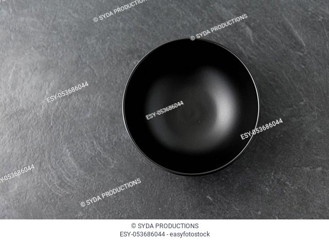 black ceramic plate on slate background