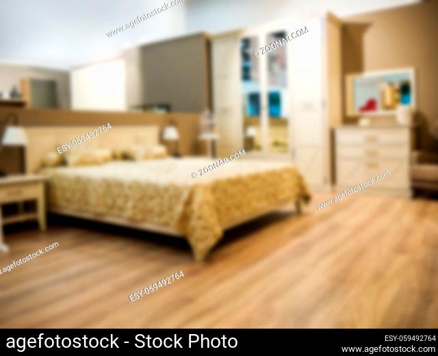 Abstract blur Interior of modern comfortable hotel bedroom. Blurred bedroom with beige bed