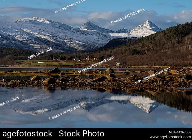 The area around Stonglandseidet and Valvag in the south of the island, Snowy mountain top, reflection