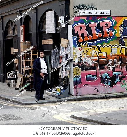 Orthodox Jew standing on street corner , East End, London