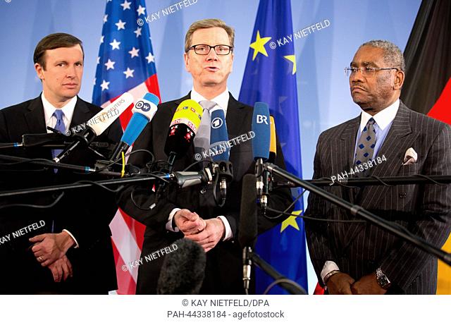 Acting German Foreign Minister Guido Westerwelle (C, FDP) stands between US Senator Christopher Murphy (L) and US congressman Gregory Meeks (L) at a press...