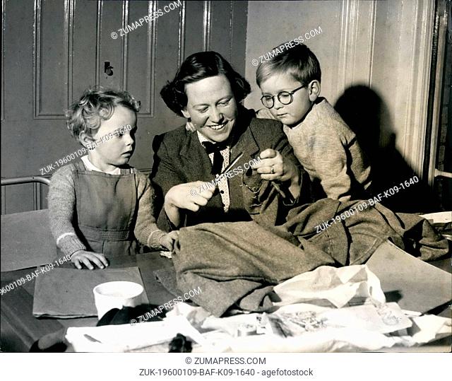 1956 - MRS. E. GLASON, gets down to some work on the sewing. machine, with her baby on her knee. The baby in no troble shells loves to watch the wheel go round